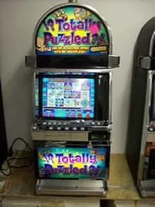 IGT Totally Puzzled refurbished slot machine for sale